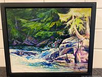 Front view of framed painting showing artwork, frame, signature