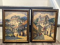 Both framed paintings side by side