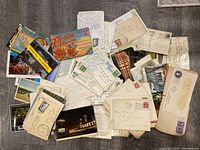 Spread of envelopes and postcards on floor