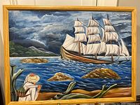 Full view framed painting showing ship scene and frame
