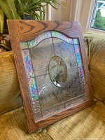 Front view of framed stained glass panel showing overall design