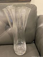 Full view of tall clear glass vase showing overall shape