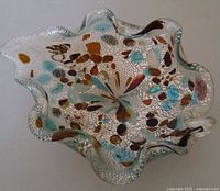 Top view showing ruffled shape and multicolour confetti with silver foil