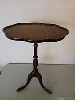 Full view of Brandt mahogany pie-crust side table
