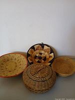 Group shot of all four handwoven baskets/trays