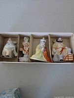 All four figurines in original box