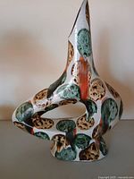 Full view of sculptural cutout ceramic vase