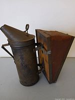 Full view showing copper barrel, conical top, and attached bellows