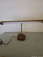 Full view of vintage fluorescent desk lamp on table