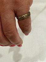 Ring on finger showing width and pattern