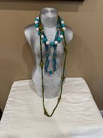 All three necklaces draped on mannequin showing relative lengths and colours