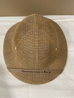 Top view showing woven texture, crown shape, logo band