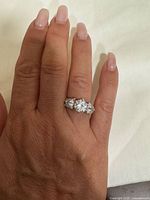 Ring on hand showing overall design and stone layout