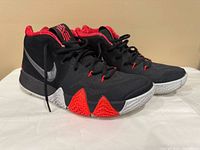 Side view of both shoes showing upper design, swoosh and midsole details