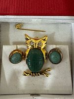 Owl brooch and earrings inside presentation box