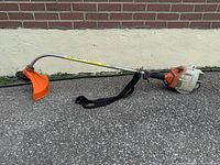 Full view of STIHL FS 36 trimmer showing shaft, guard and strap
