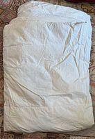 Folded white feather/down twin duvet