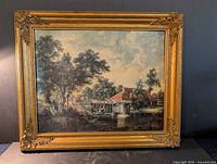 Front view of first frame showing mill scene print and ornate frame details