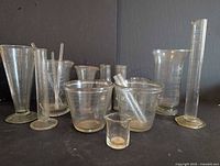 Group view of all glass beakers, cylinders and rods