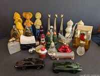 All 22 Avon figural bottles grouped