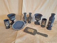 Group shot of eight blue jasperware-style Avon pieces