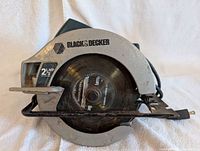 Front view showing Black & Decker branding and 2 1/3 HP rating on blade guard