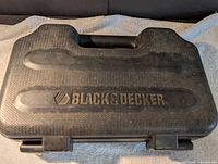 Closed black textured Black & Decker branded carry case