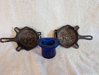 Full lot showing both cast iron ashtrays and cobalt glass toothpick holder