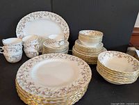 All pieces arranged: serving platter, dinner plates, salad plates, bowls, teacups
