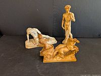 All three statues grouped for scale and overview