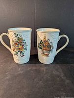 Front view of both Mikasa mugs showing holiday decals