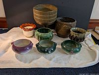 Group shot of all eight pots