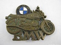 Front view of brass BMW motorcycle belt buckle