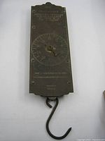 Front view of Chatillon 60 lb spring balance showing dial, branding, and damaged pointer