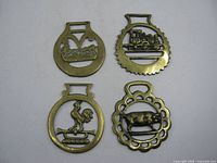 Group shot of all four brass ornaments