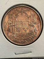 Reverse side displaying Canadian coat of arms and date 1944