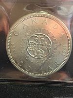 Reverse of 1964 Charlottetown-Québec silver dollar