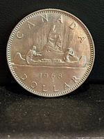 Reverse showing CANADA, canoe scene, date 1968