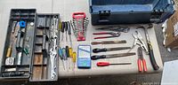 Overhead view of toolbox tray and laid-out tools
