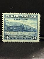 Front of blue 24¢ Newfoundland stamp showing Bell Island loading pier