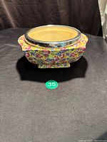 Overall view of James Kent Royalty chintz footed bowl, metal rim visible