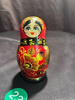 Front view of largest doll showing face and floral design