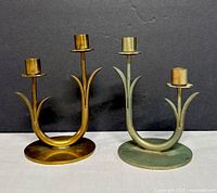 Front view of both candle holders showing finishes and design