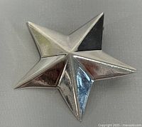 front view of silver star brooch pendant