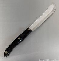 Full view of Cutco butcher knife showing blade shape and handle
