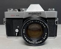 Front view showing model name, lens details and condition