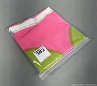 Folded Marimekko Kaivo fabric sealed in plastic