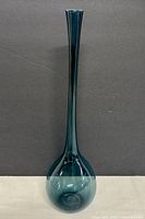 Full view of vase against dark background showing color and form