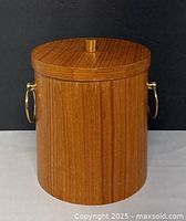 Full view of teak ice bucket with lid on