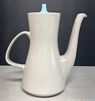 Side view of Poole Pottery coffee pot showing body, spout, handle